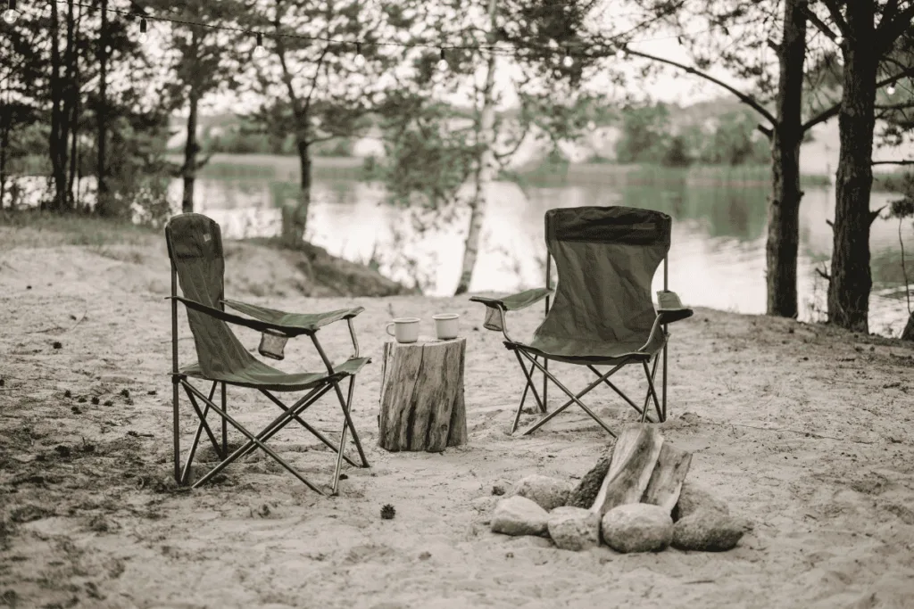 Two chairs beside a lake