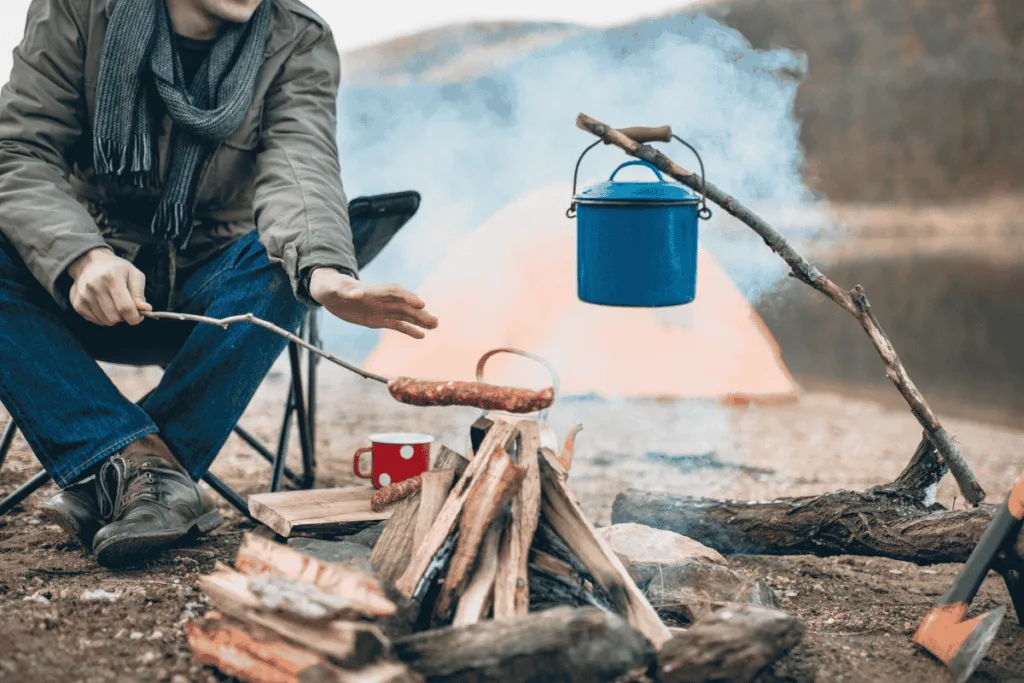 Cooking food over a campfire